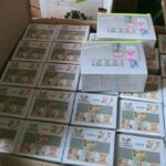 Toothpaste dispenser and toothbrush holder