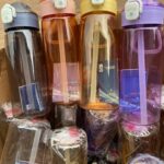 Colorful water bottle with straw